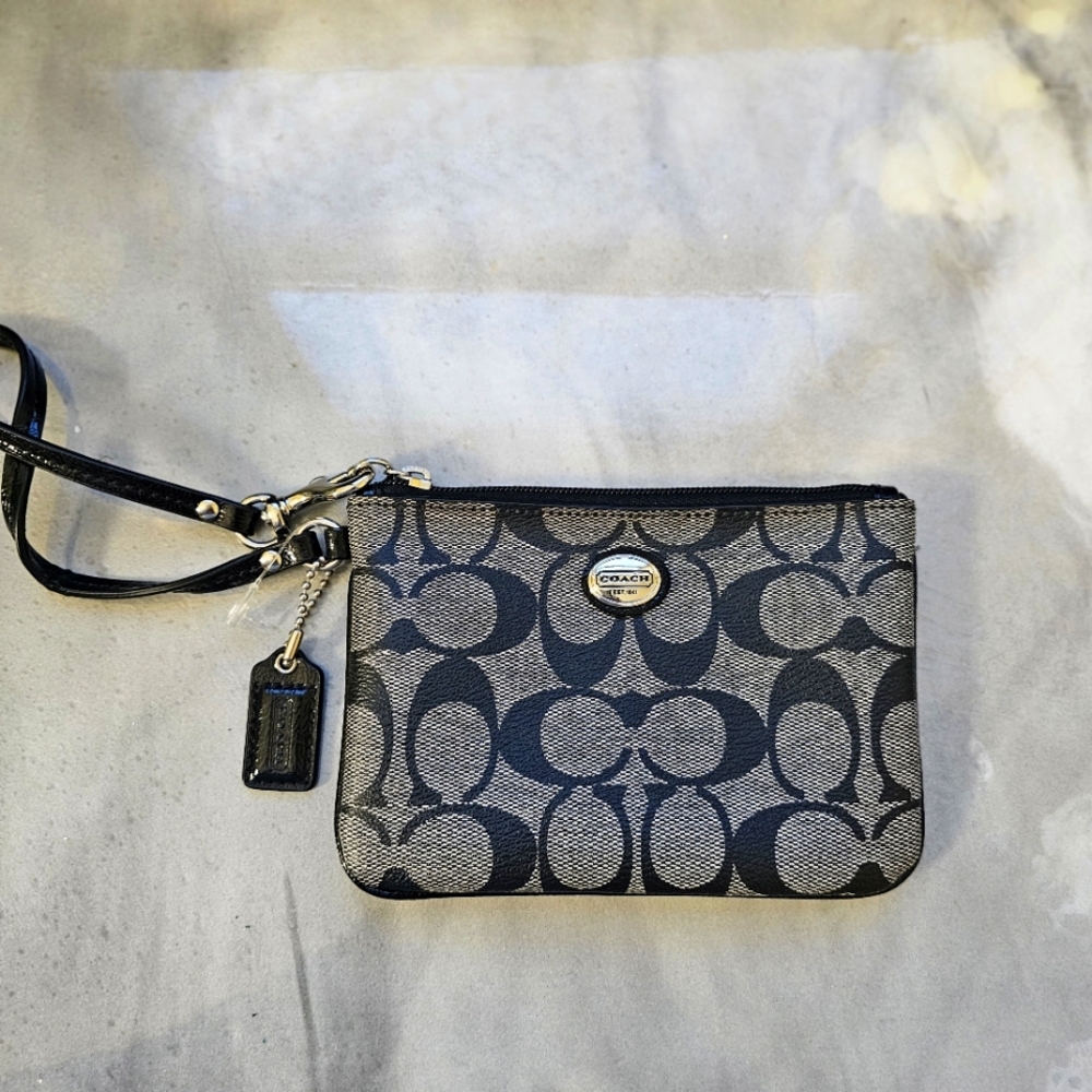 Coach signature wristlet.